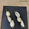 Boucles d'Oreilles "Cascade de Cauris" – L'Appel du Soleil
